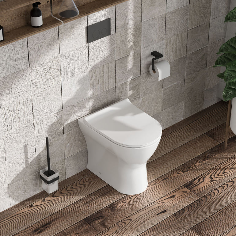 nuie Freya Round Back to Wall Toilet Pan With Seat - Lifestyle image